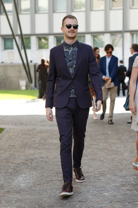 Tailored suit with fun and casual twist of patterned shirt and classy tennis shoes